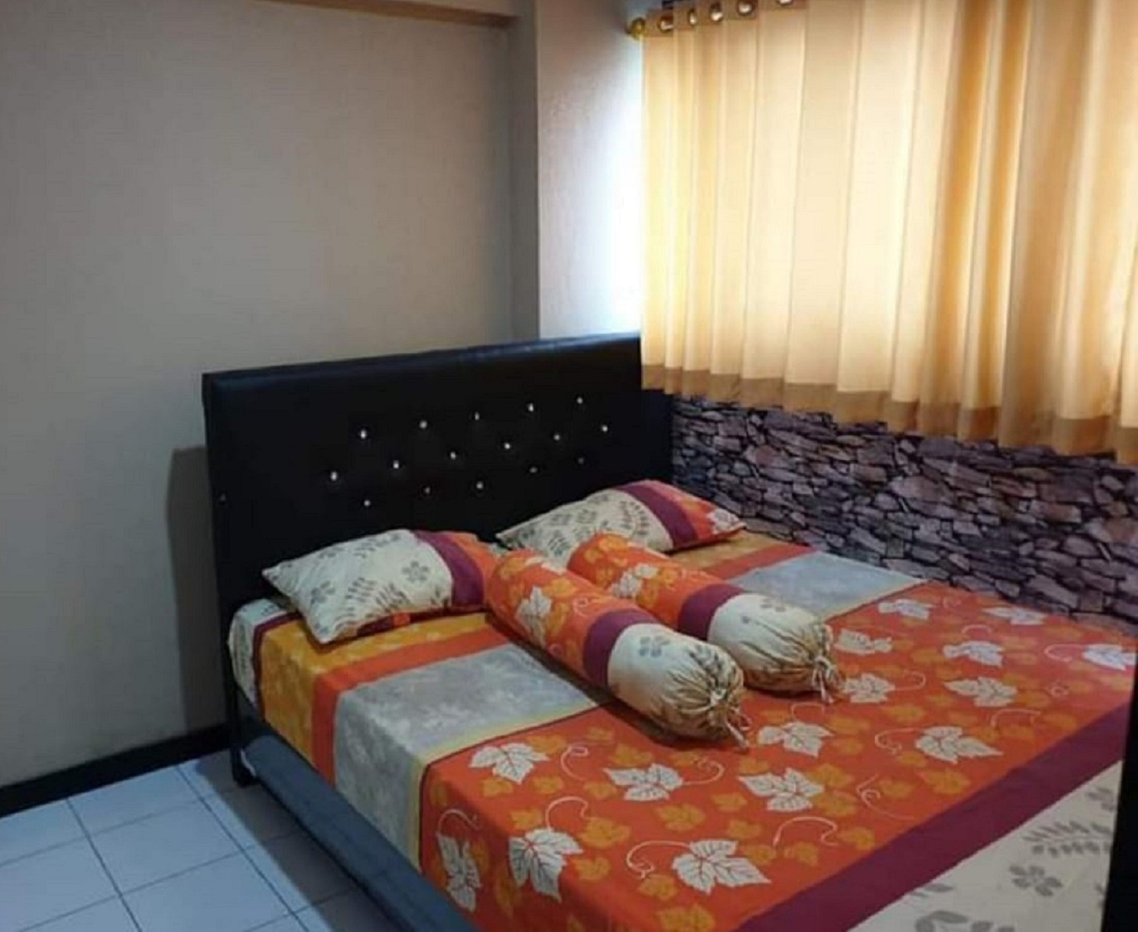 The Roomos Hotel Apartemen