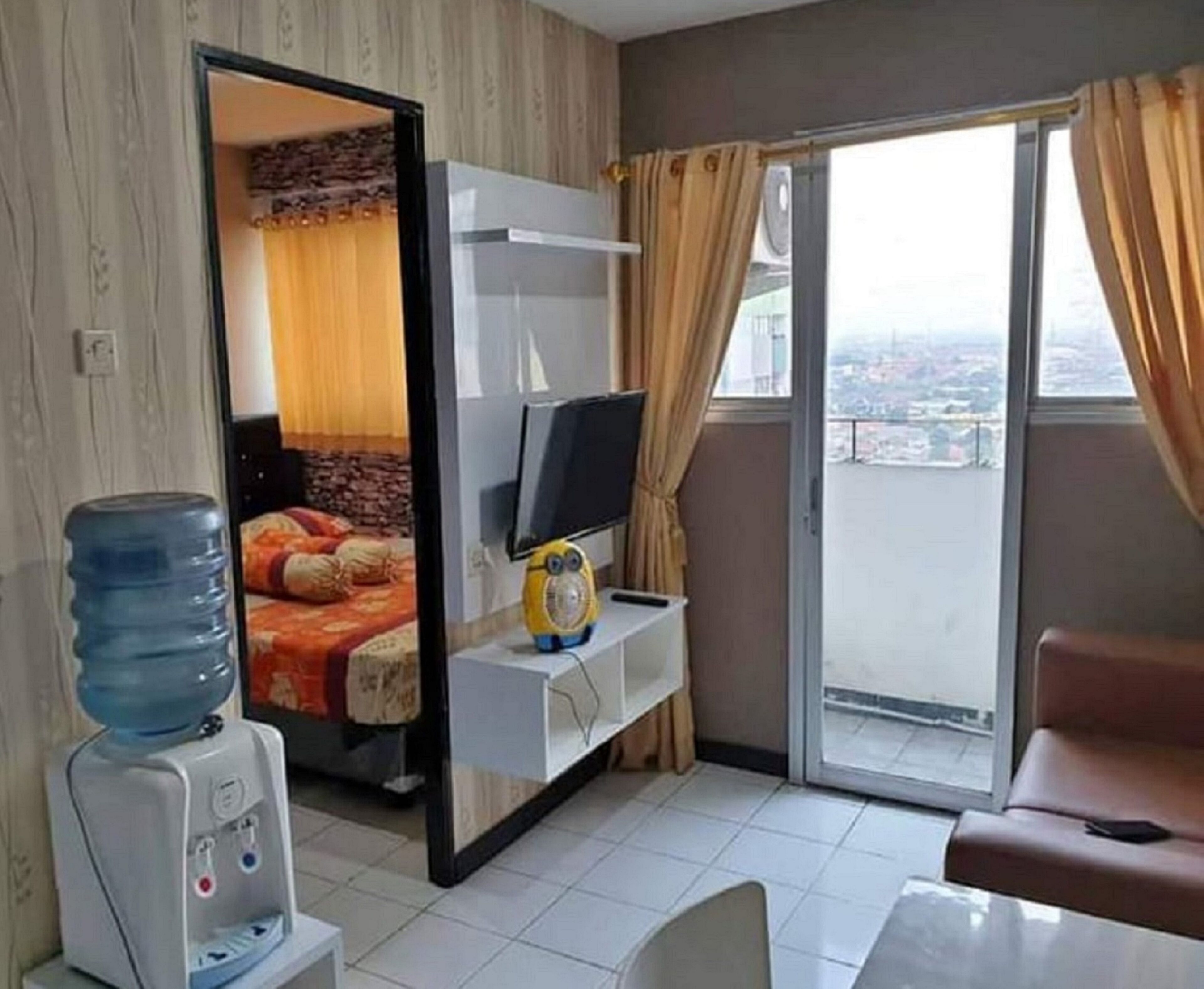 The Roomos Hotel Apartemen
