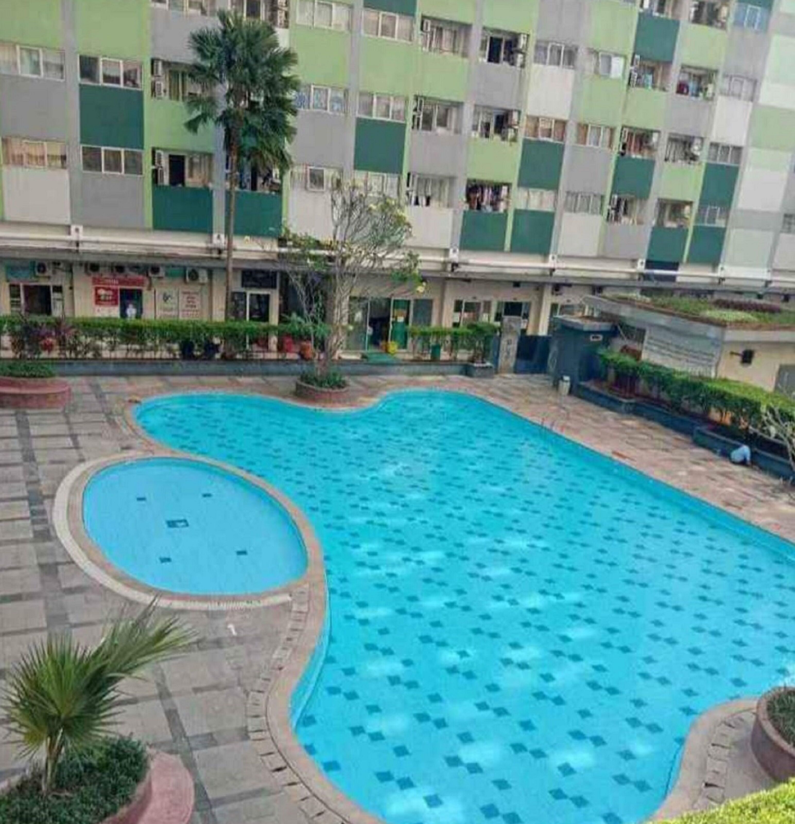 The Roomos Hotel Apartemen