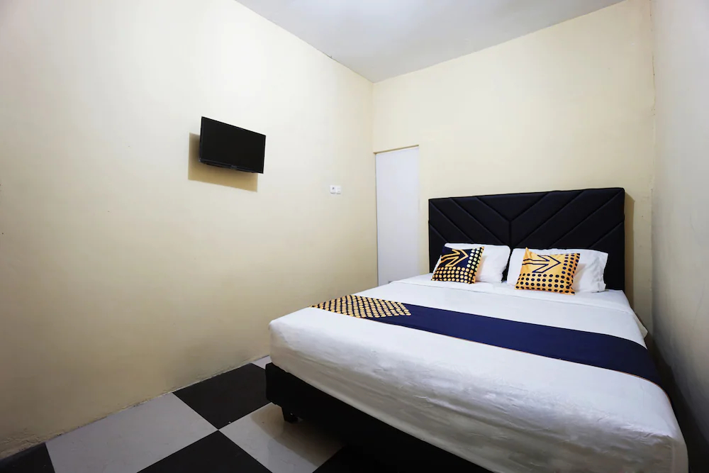 Tiga Mas Inn by OYO Rooms