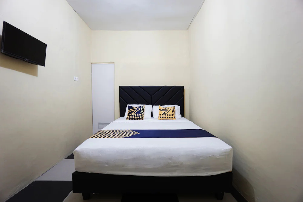 Tiga Mas Inn by OYO Rooms