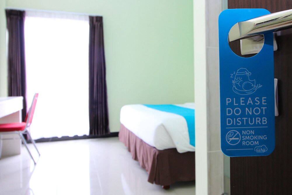 Purple Hotel Palu By Airy Rooms