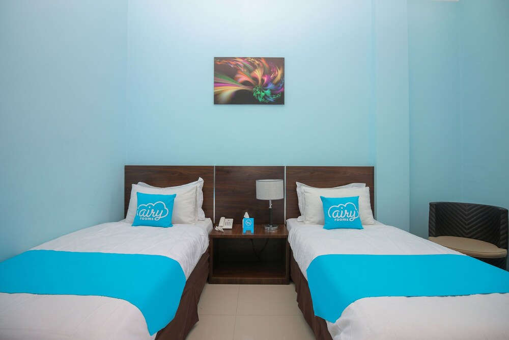 Purple Hotel Palu By Airy Rooms