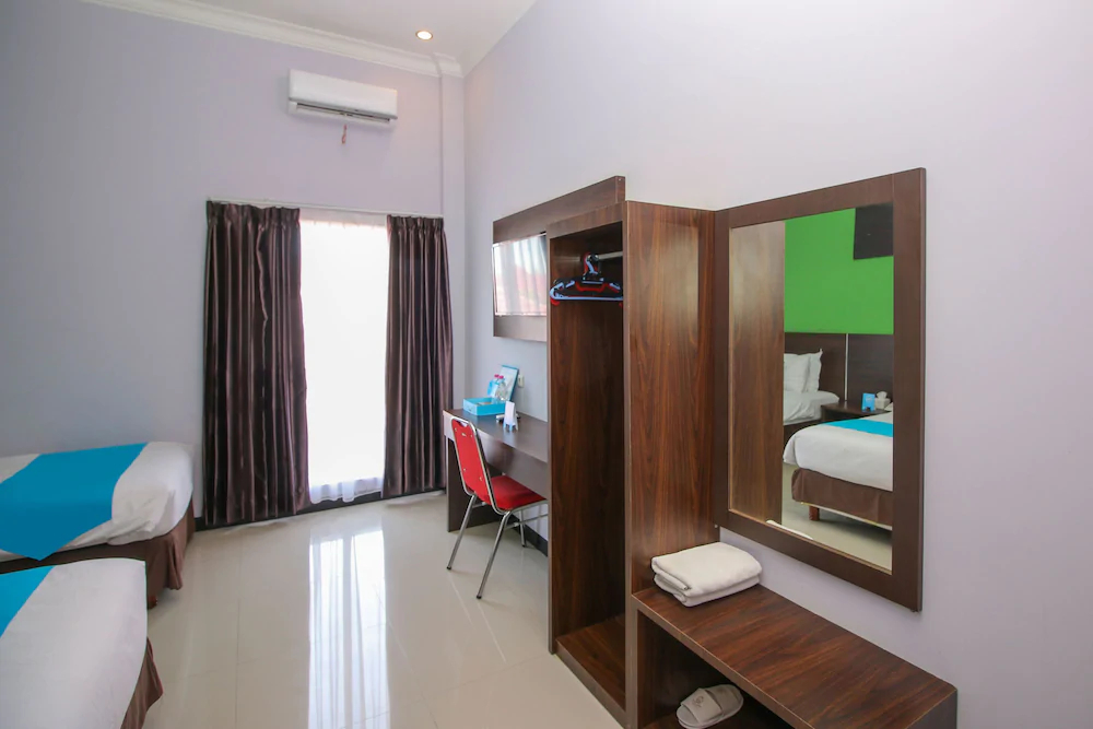 Purple Hotel Palu By Airy Rooms