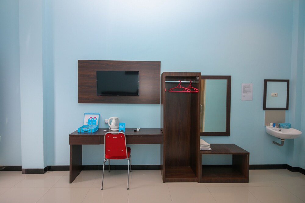 Purple Hotel Palu By Airy Rooms