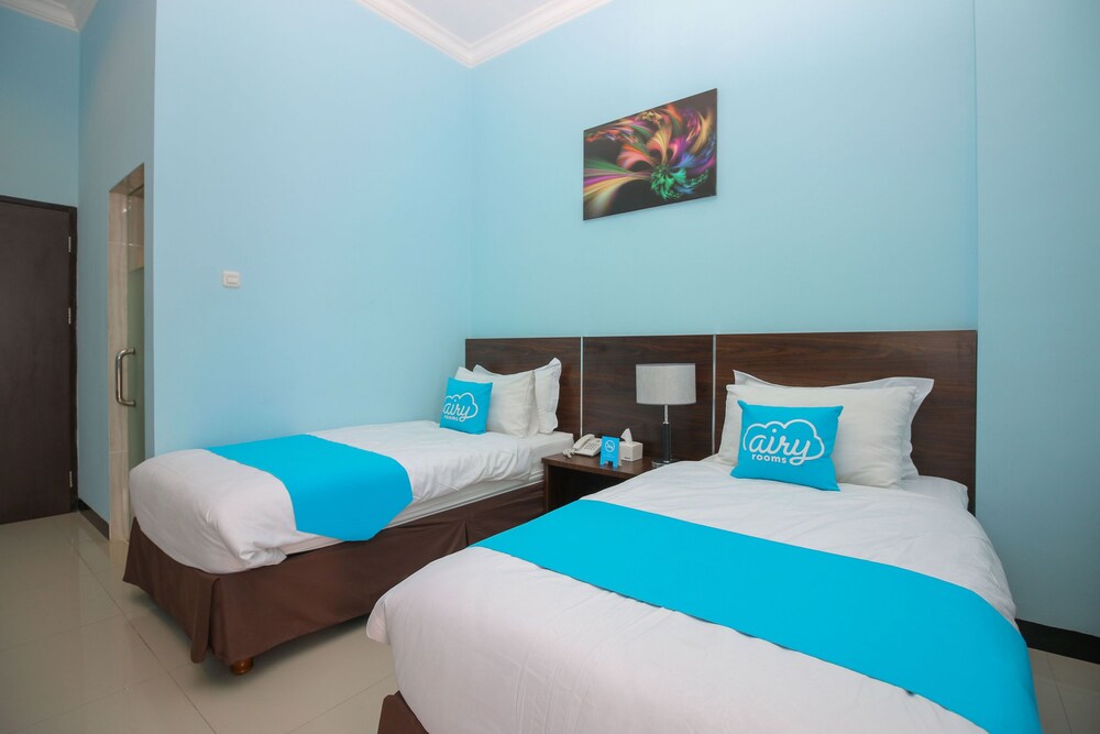 Purple Hotel Palu By Airy Rooms