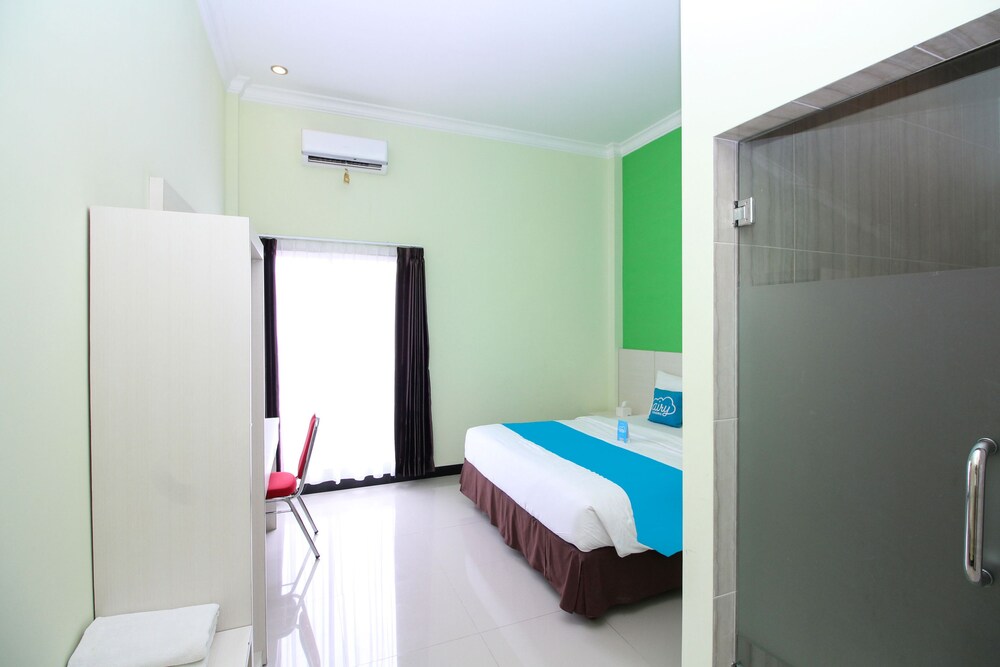 Purple Hotel Palu By Airy Rooms
