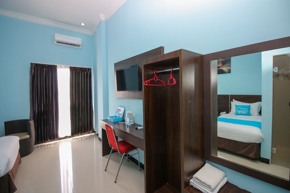 Purple Hotel Palu By Airy Rooms