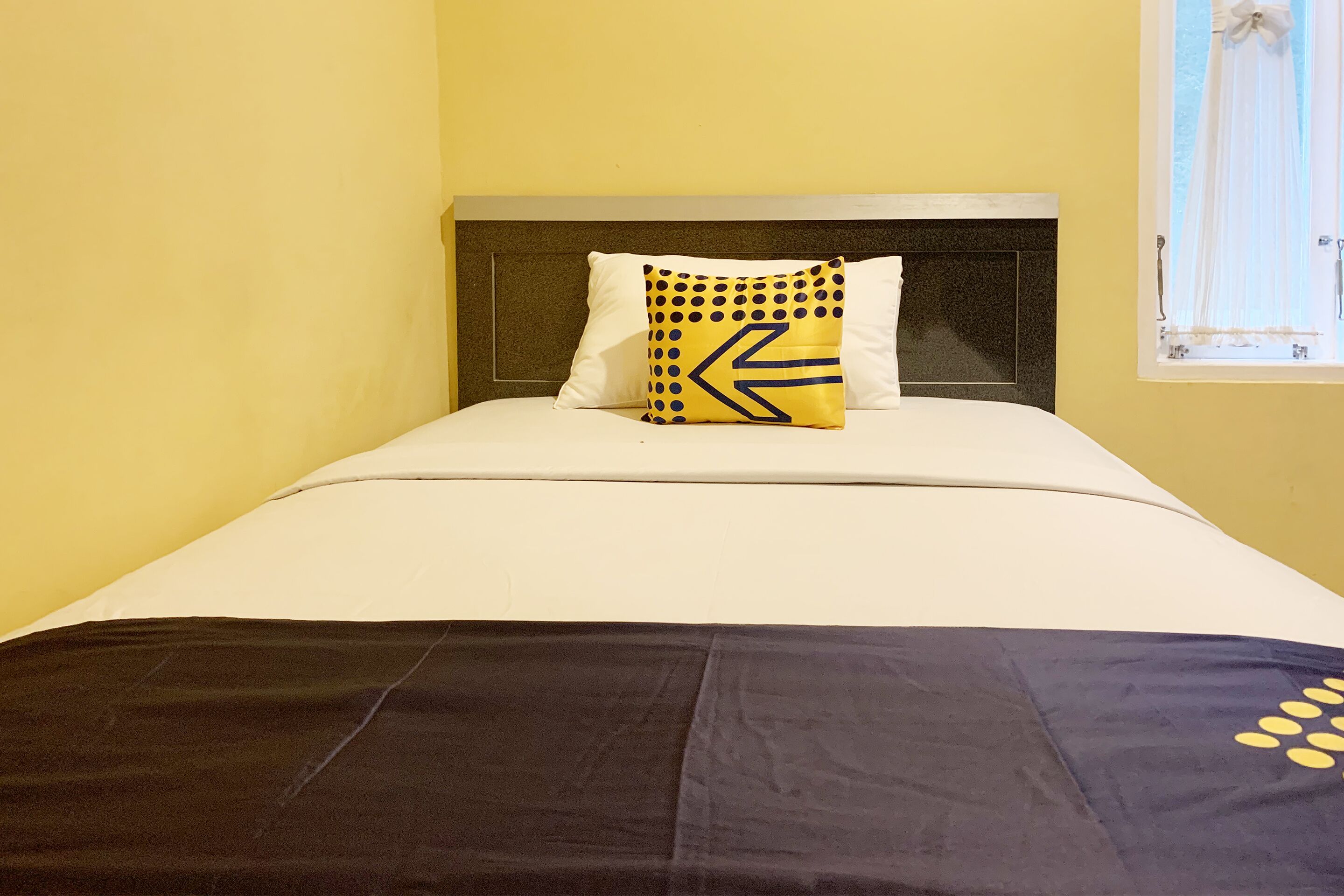 Mande Guesthouse by RedDoorz