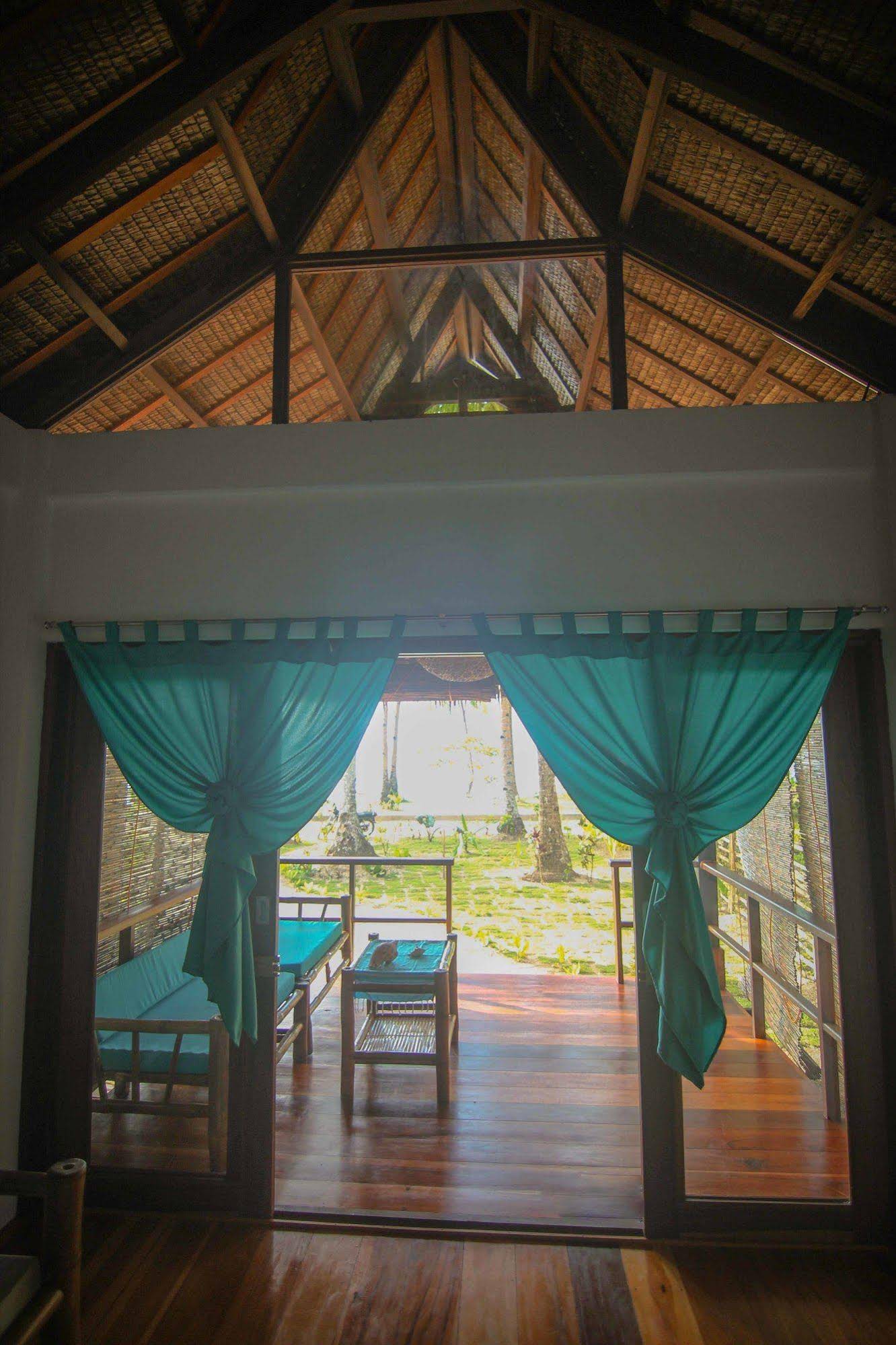 Surfing Carabao Beach Houses