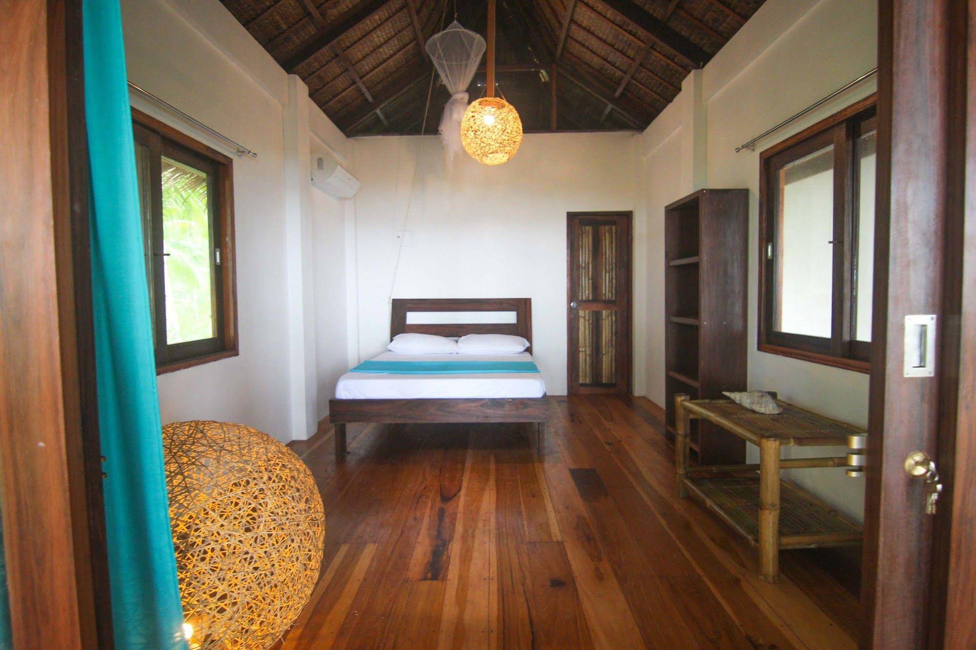 Surfing Carabao Beach Houses