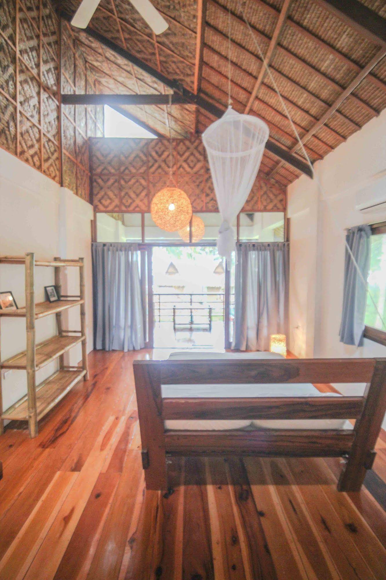 Surfing Carabao Beach Houses