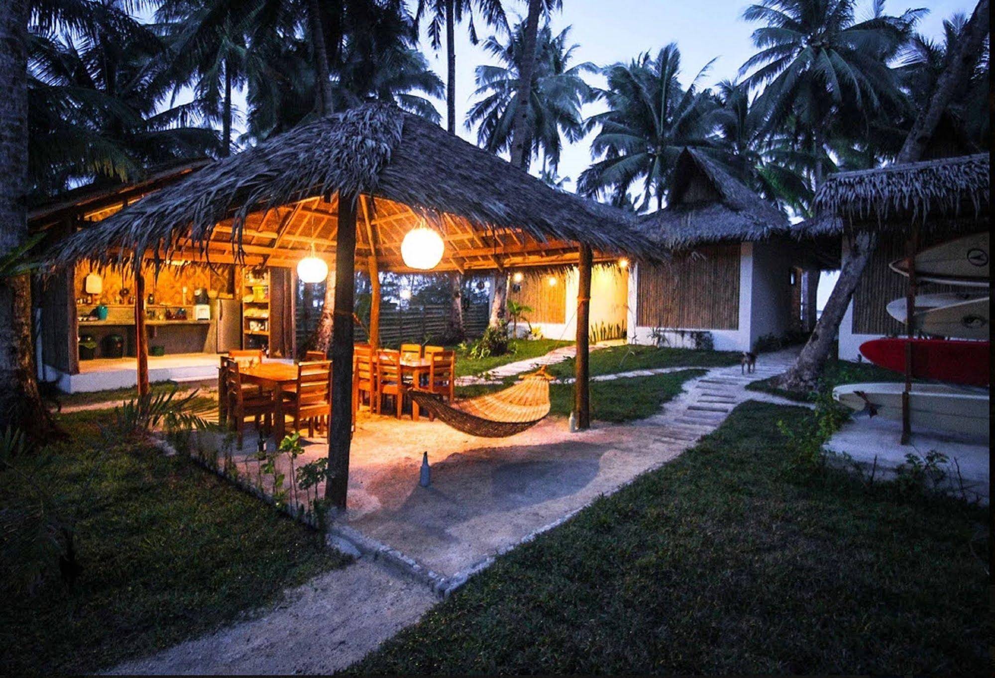 Surfing Carabao Beach Houses