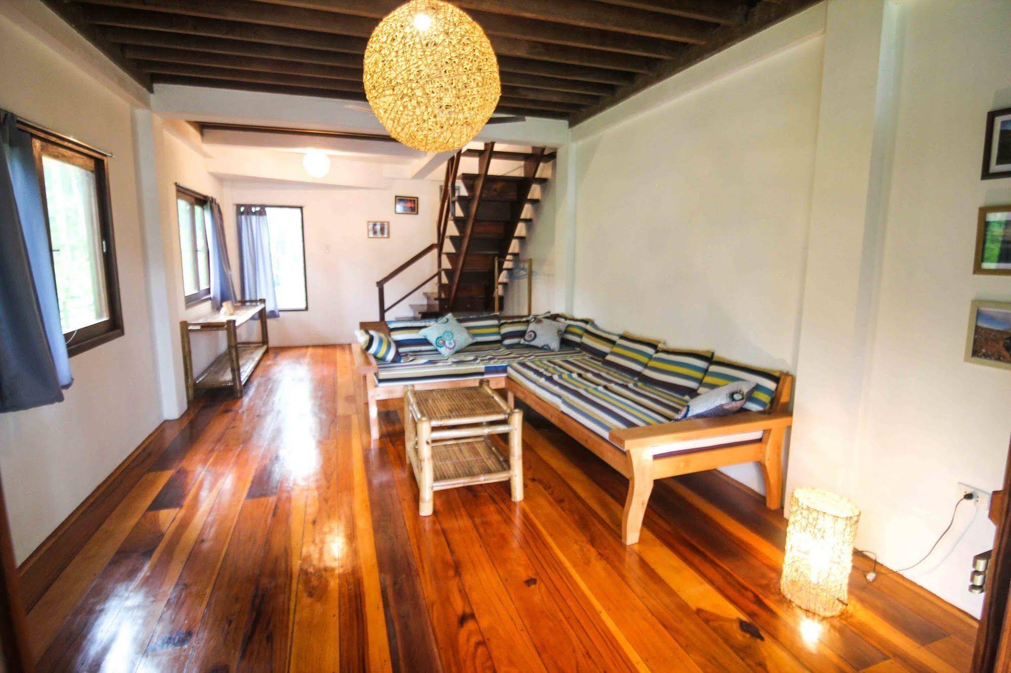 Surfing Carabao Beach Houses